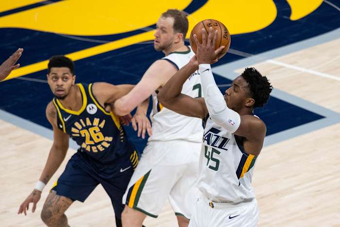 Donovan Mitchell (45) shoots a three pointer over the Indiana Pacers